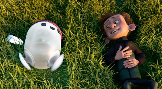 Still from Ron's Gone Wrong: an animated boy and a small white robot lie side by side on grass.